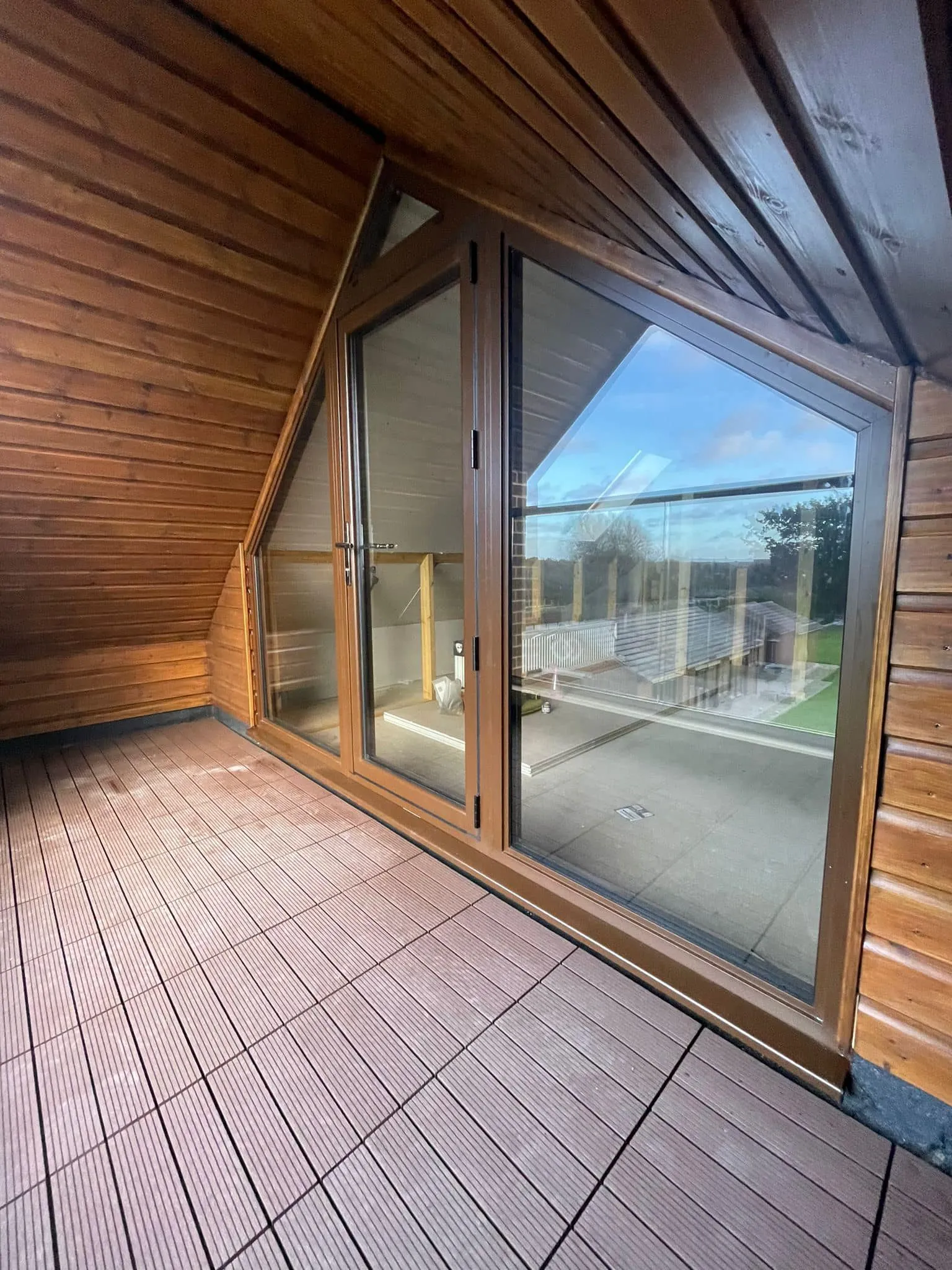 large window with sloped roof