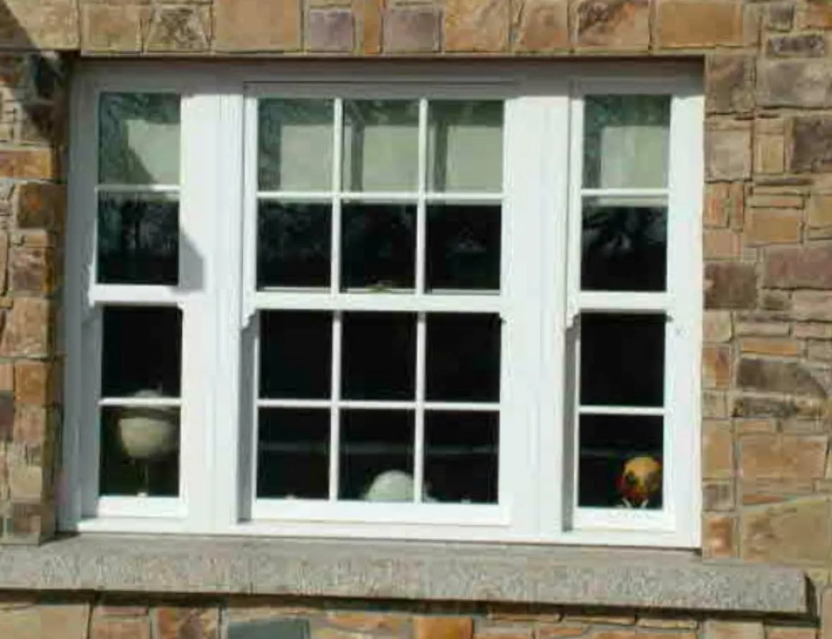 white window in stone house