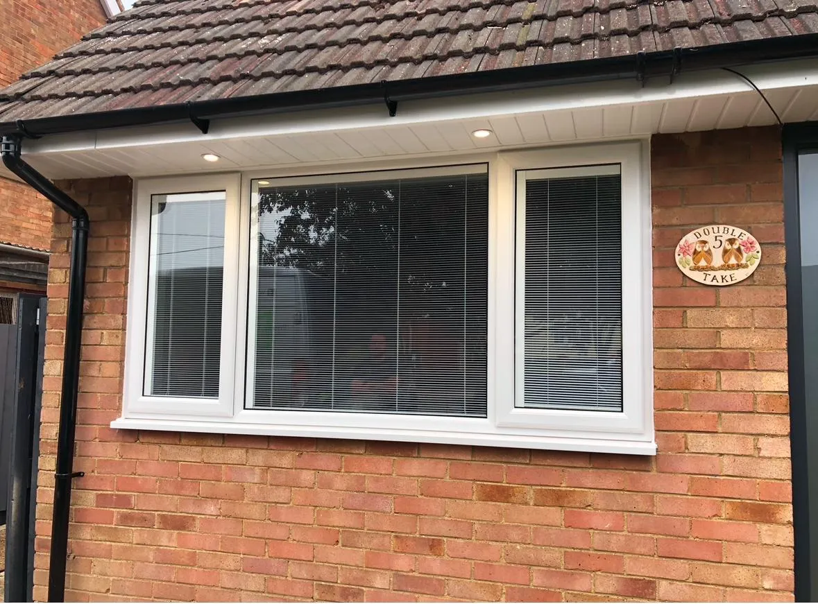 white kitchen window with name plate